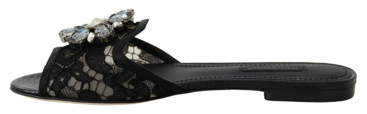 Elegantes mules de encaje negro con detalle de flor joya de Dolce &amp; Gabbana