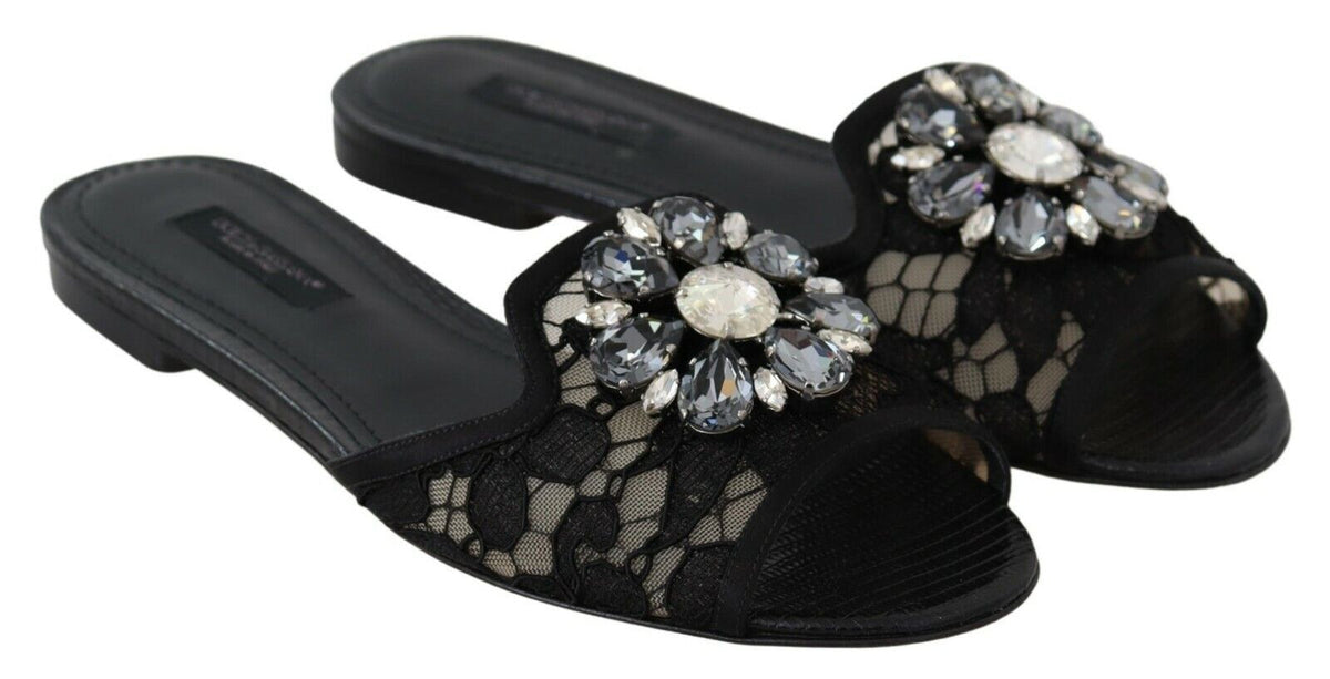 Elegantes mules de encaje negro con detalle de flor joya de Dolce &amp; Gabbana