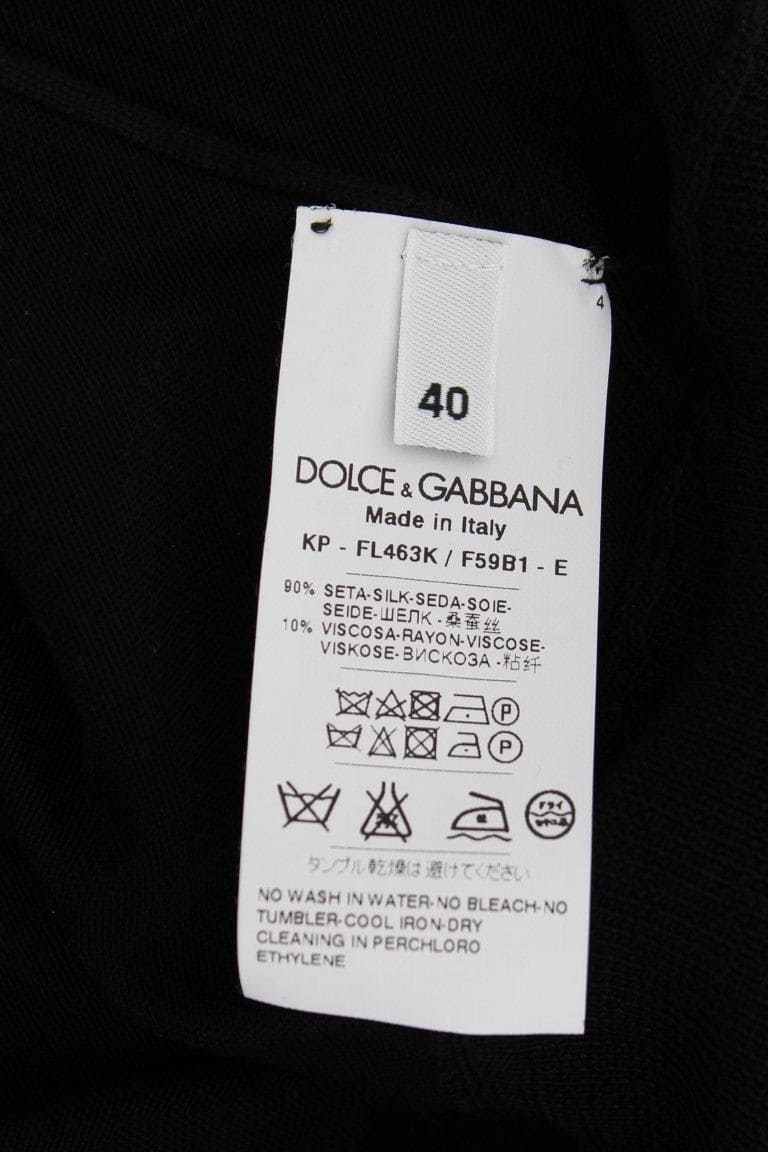 Polo elegante de seda negra con estampado floral de Dolce &amp; Gabbana