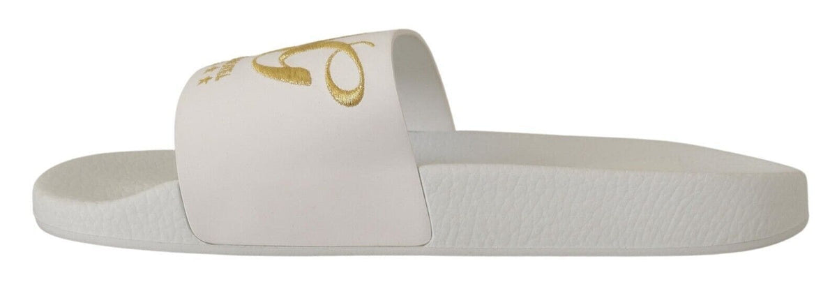 Sandalias elegantes de piel blanca con bordados dorados de Dolce &amp; Gabbana