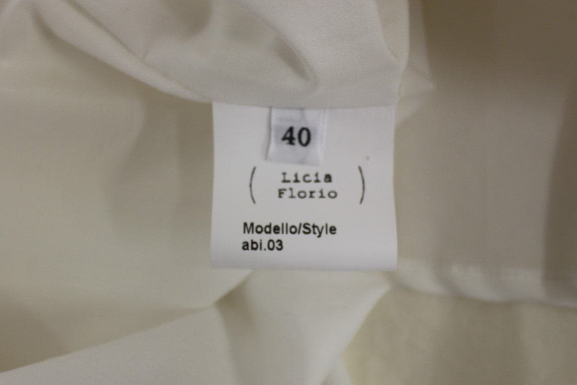 Vestido elegante de té blanco con cuello halter de Licia Florio