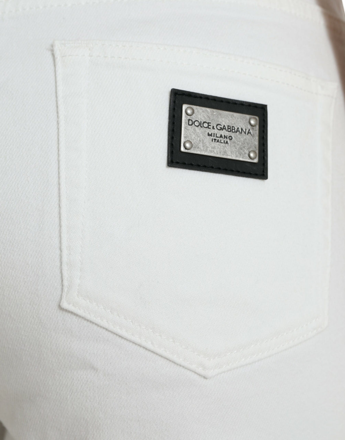 Elegantes jeans blancos de tiro medio con corte de mezclilla recortado de Dolce &amp; Gabbana