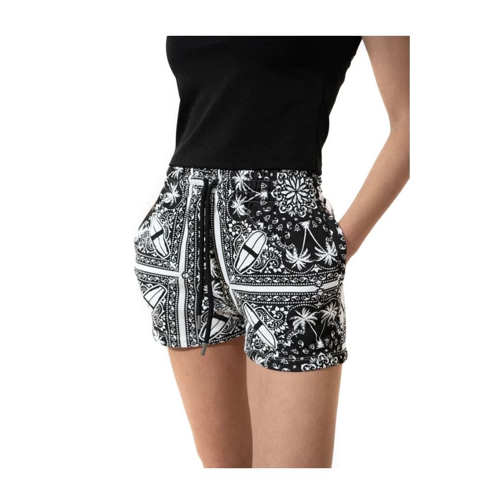 Short en coton monochrome à imprimé palmiers de Comme Des Fuckdown Chic