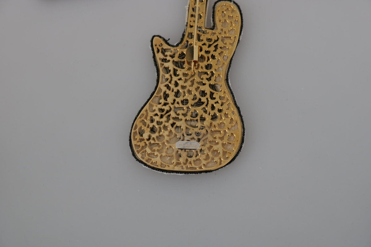 Broche con forma de guitarra y lentejuelas doradas de Dolce &amp; Gabbana